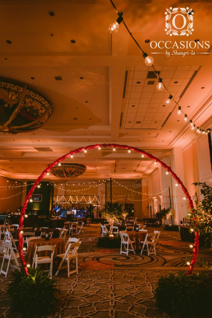 Market light wrapped "o" arch entrance into beer garden reception. #OBSevents